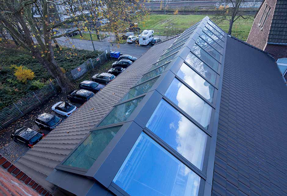 Aerial view of VELUX Skylight solutions with Ridgelight 25˚-40˚, conversion of fire station into offices, Germany